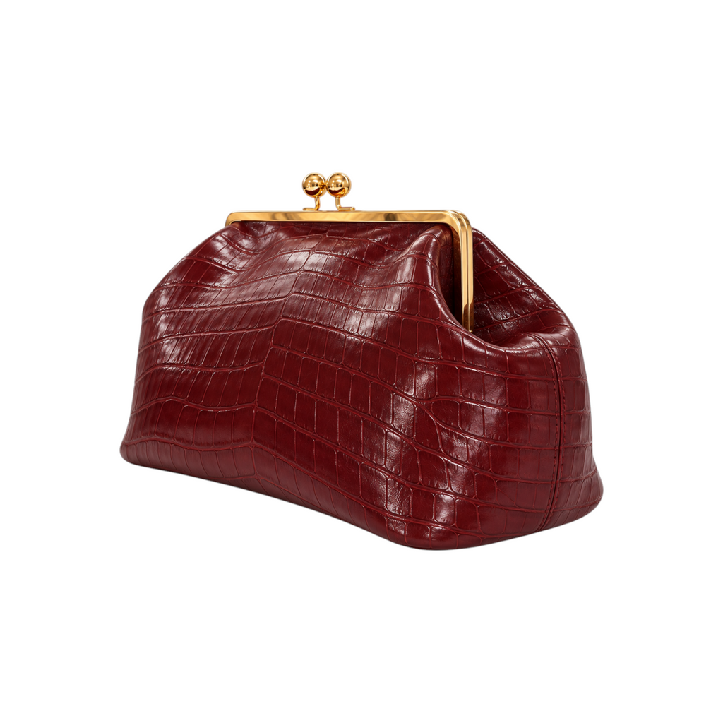 Jesalin Sette handbag in vino glossy crocodile-embossed leather with a gold-tone kisslock closure.