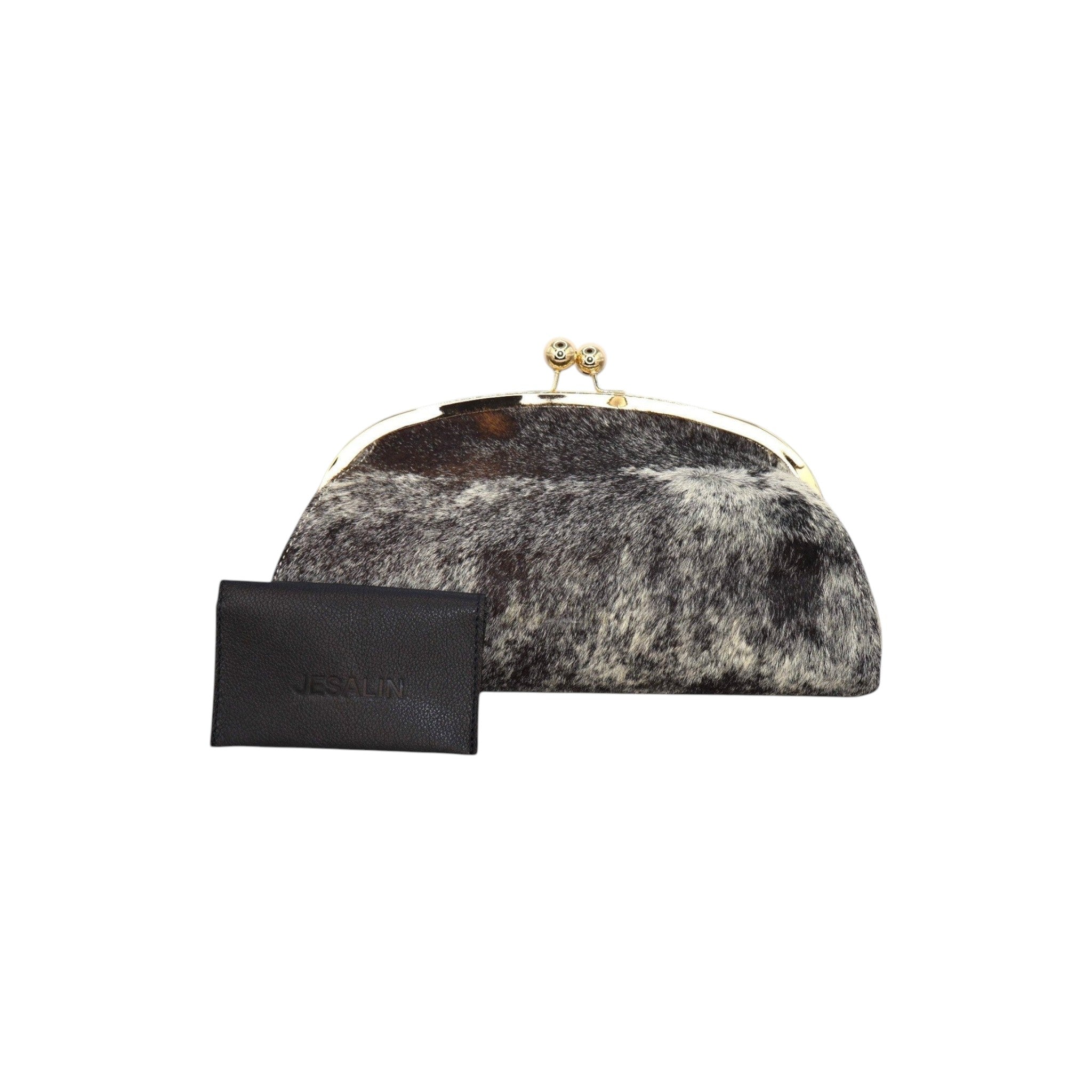 Jesalin Aluna rigid clutch in cow print hair-on hide with a gold kiss lock frame and matching black leather card holder