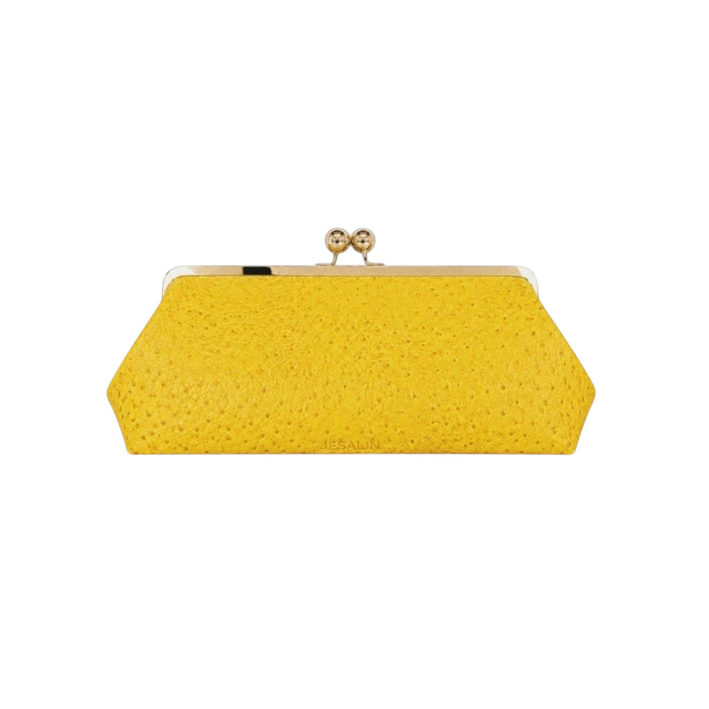 Bolso de mano Jesalin Sette Lungo amarillo en piel bovina con grabado de avestruz y cierre kisslock dorado.