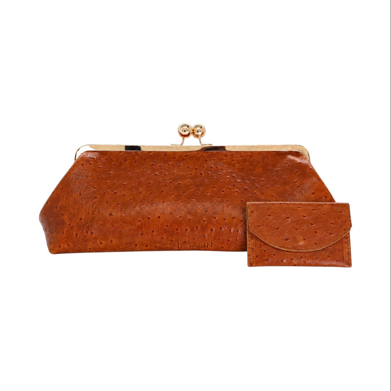 Bolso de mano Jesalin Sette Lungo en piel color coñac con grabado de avestruz y cierre kisslock dorado.