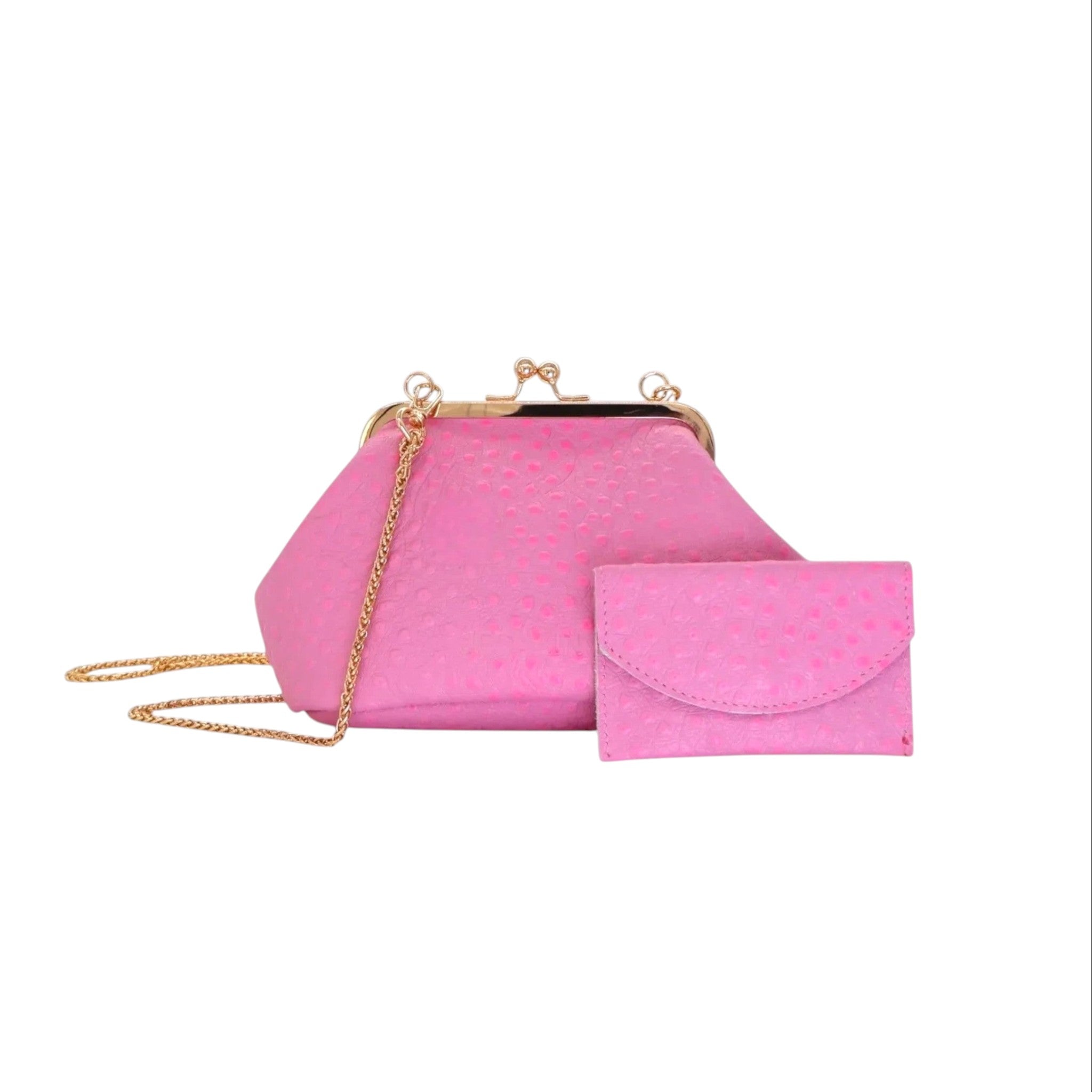 Bolso Sette Petito Jesalin rosa en piel con grabado de avestruz, cierre kisslock dorado y cadena metálica a juego.