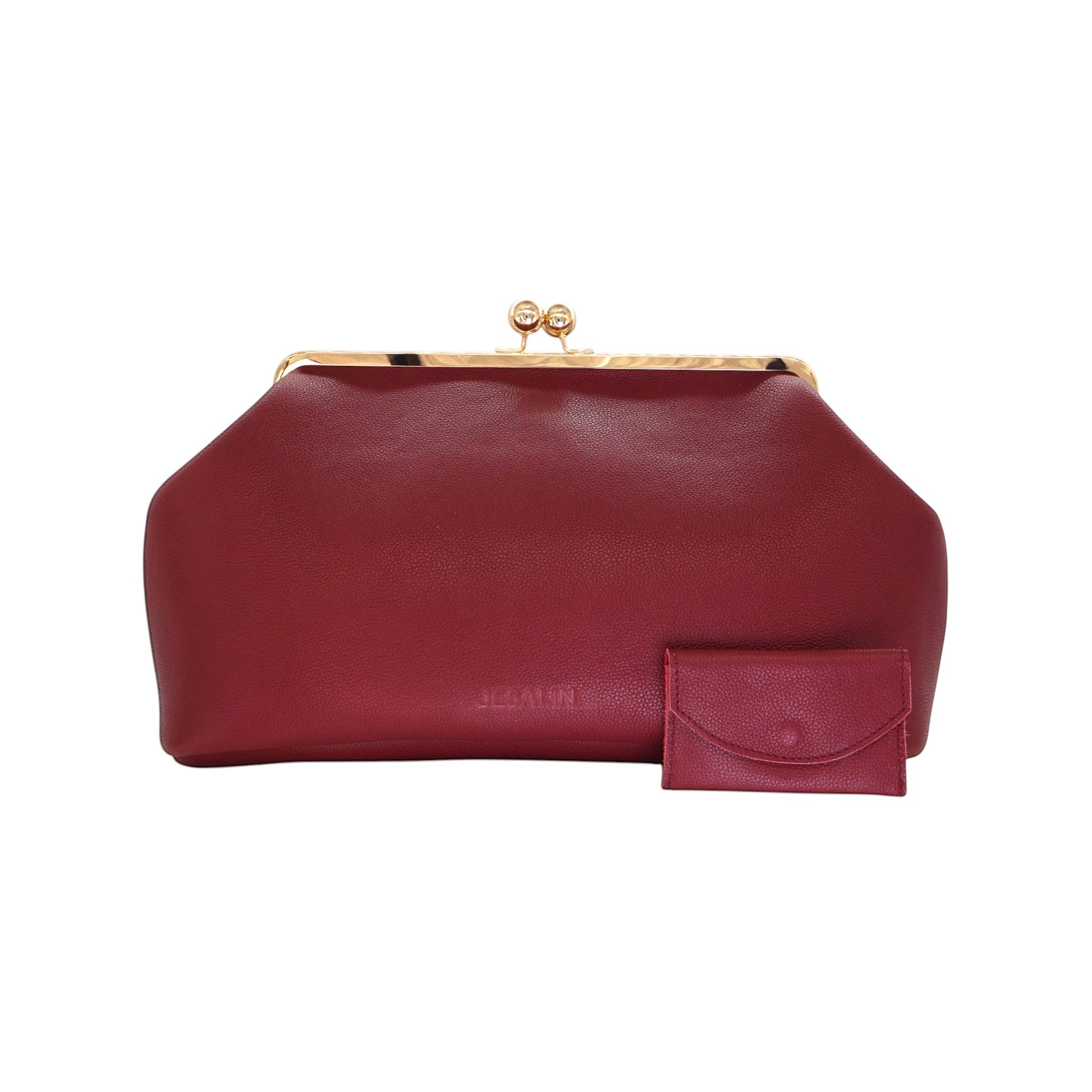 Bolso Jesalin Sette en piel bovina granulada color vino con cierre kisslock dorado y monedero a juego.