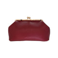 Bolso de mano Jesalin Sette en piel bovina granulada color vino con cierre kisslock dorado y diseño elegante.