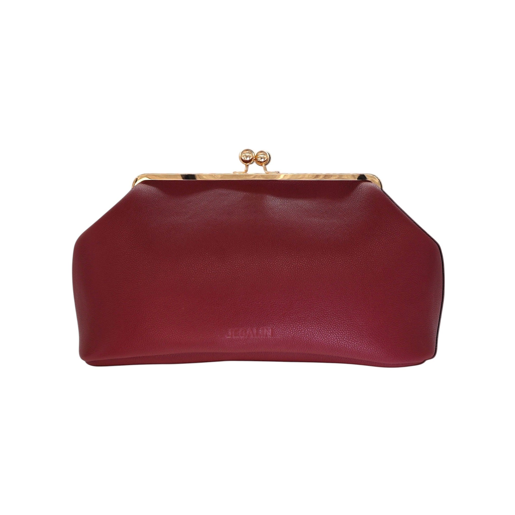 Bolso de mano Jesalin Sette en piel bovina granulada color vino con cierre kisslock dorado y diseño elegante.