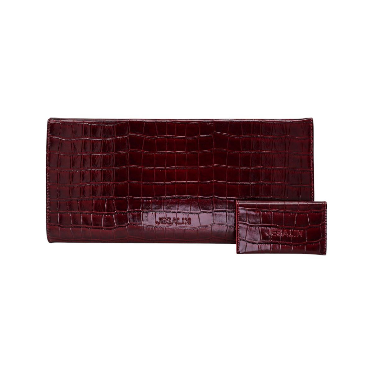 Jesalin Riga clutch in glossy wine-colored bovine leather with crocodile embossed texture and matching card holder.