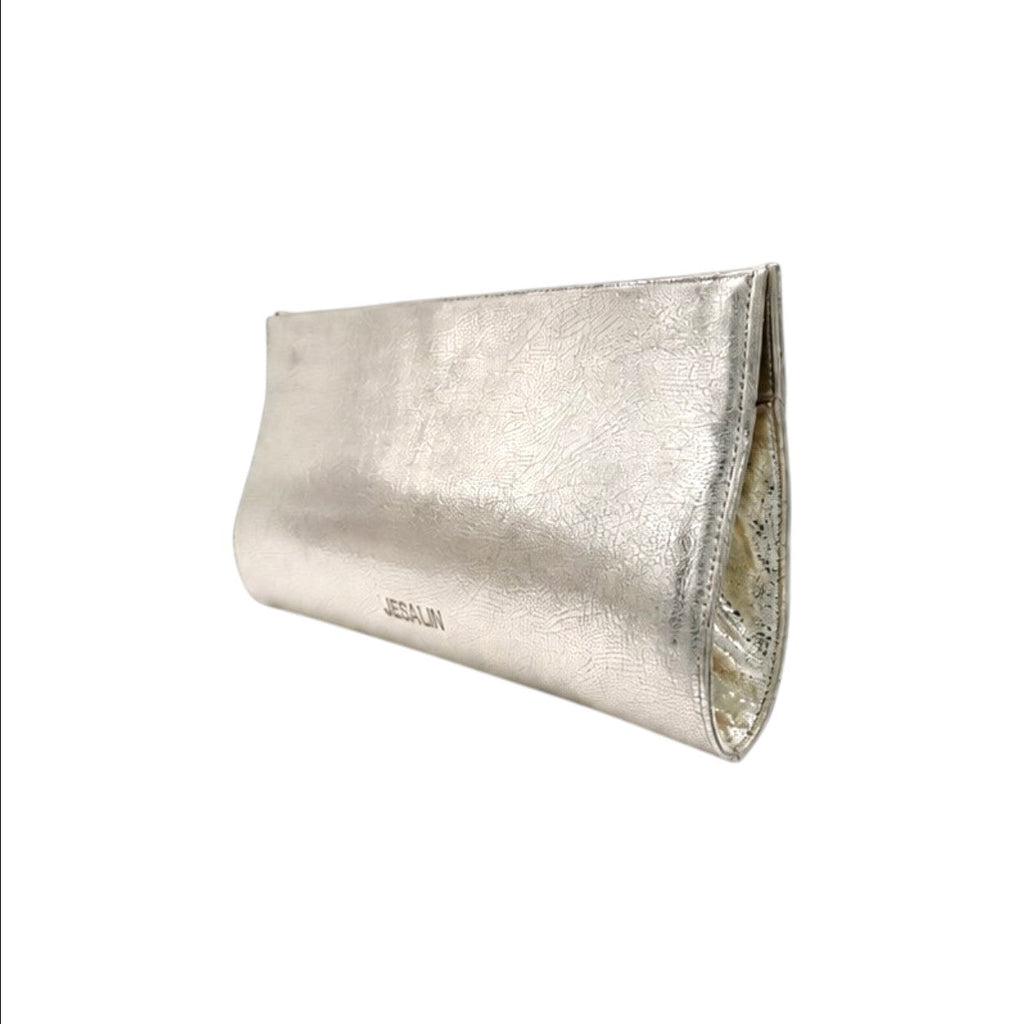 Jesalin Riga clutch in metallic platino cowhide leather with a structured, elongated silhouette and magnetic closure.