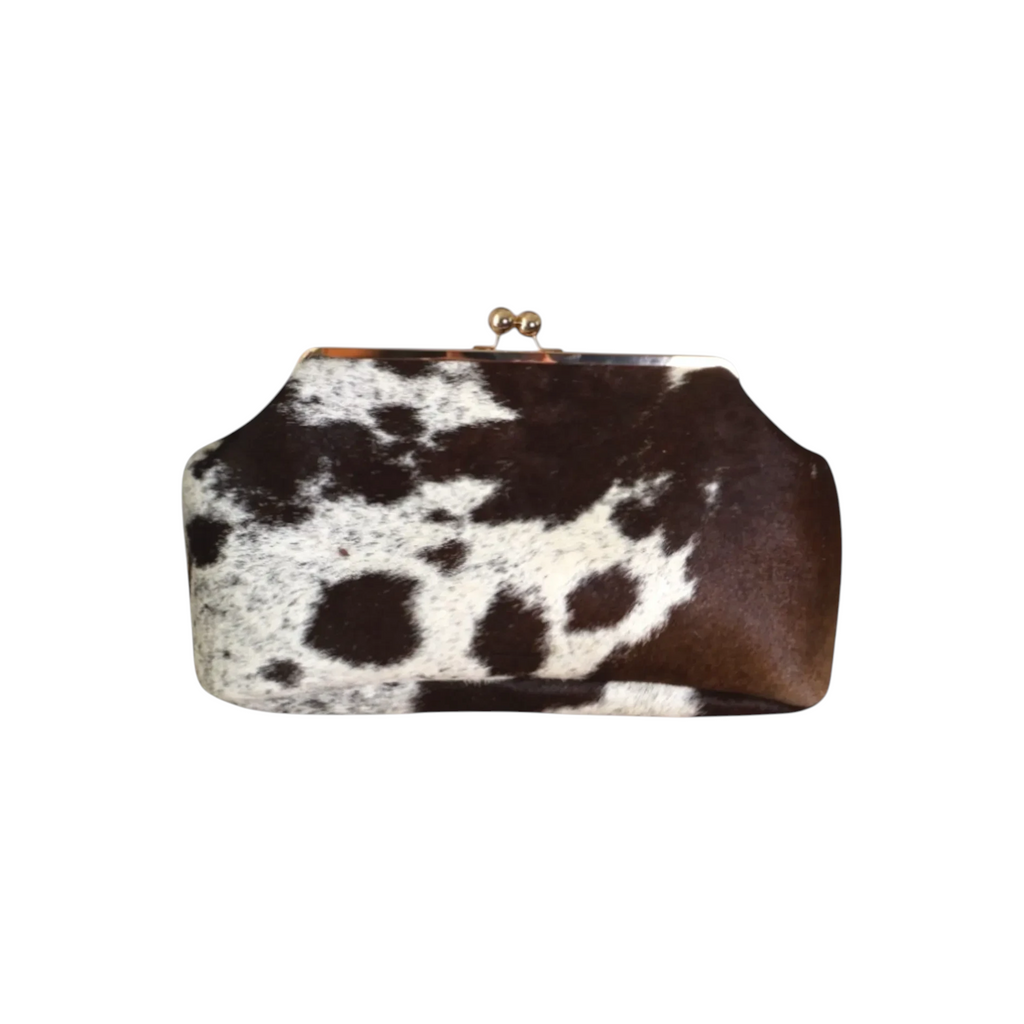 Jesalin Sette extra large structured pouch in cow print hair-on-hide leather with a vintage metal clasp closure