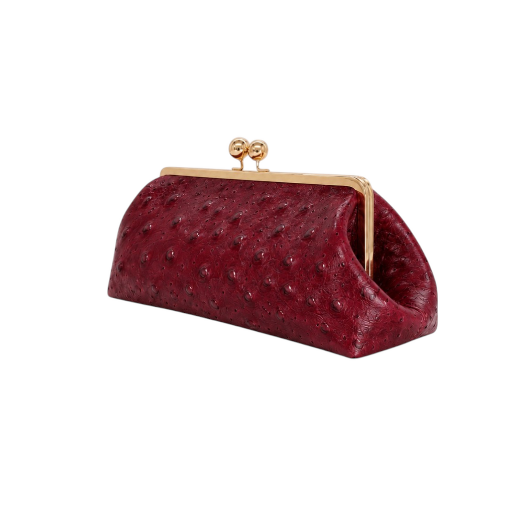 Jesalin Sette Lungo clutch in wine red ostrich-embossed leather with gold kisslock closure and soft pleated design.