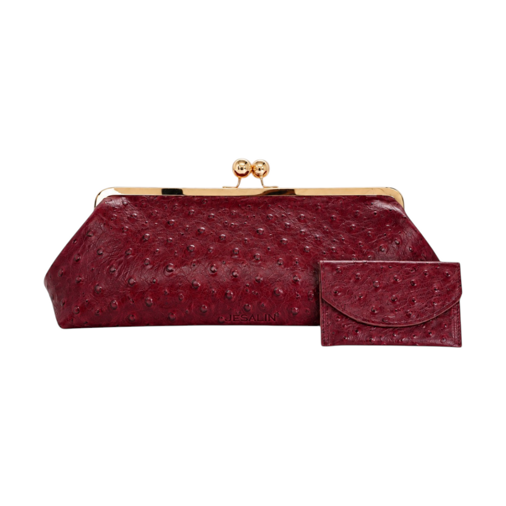 Jesalin Sette Lungo clutch in wine red ostrich-embossed leather with gold kisslock hardware and matching card holder.