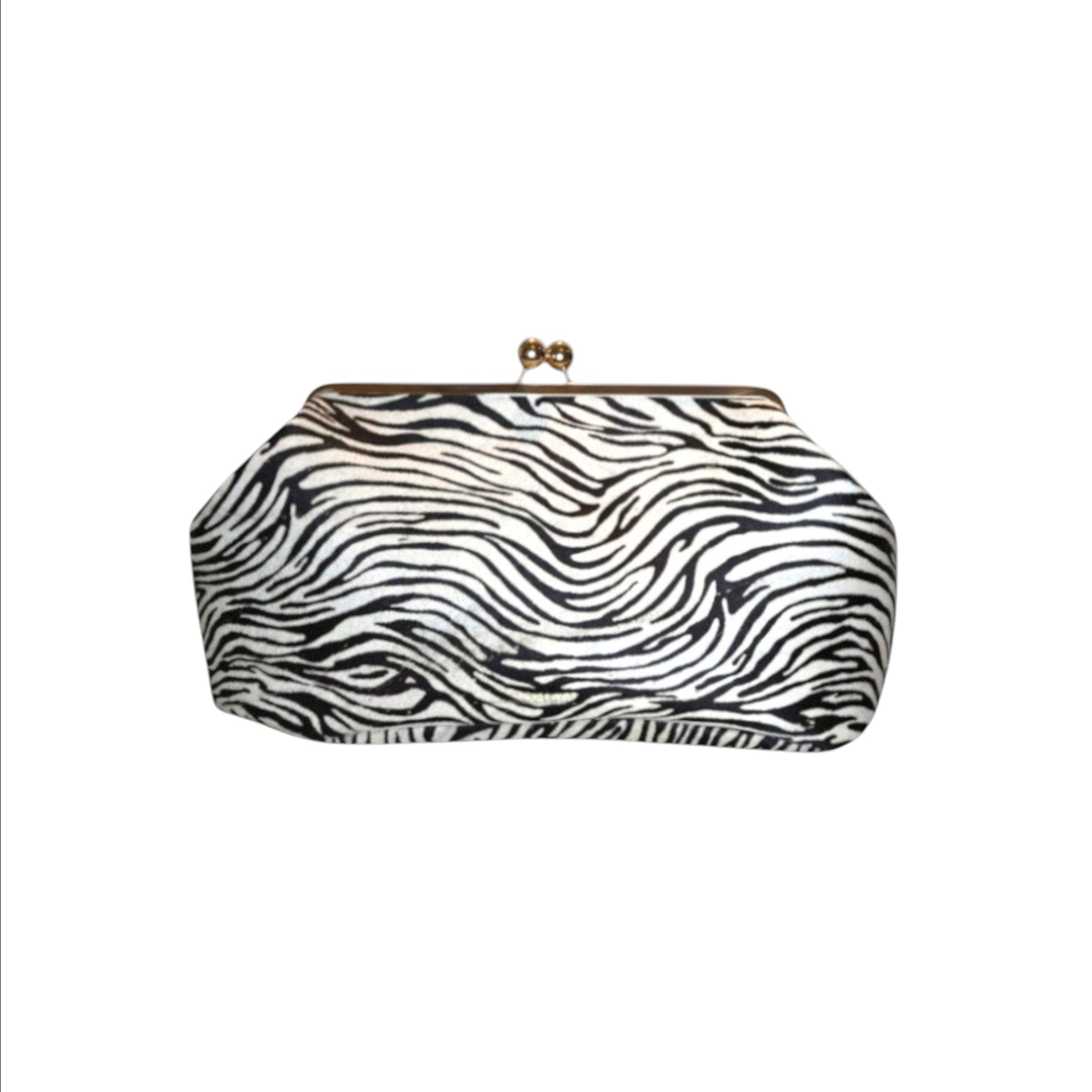 Jesalin Sette zebra print cowhide leather structured clutch with a gold kiss-lock closure